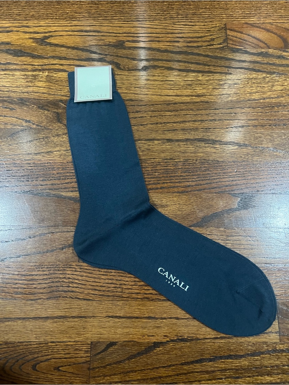 Canali dress socks featuring the brand's logo printed along the side.